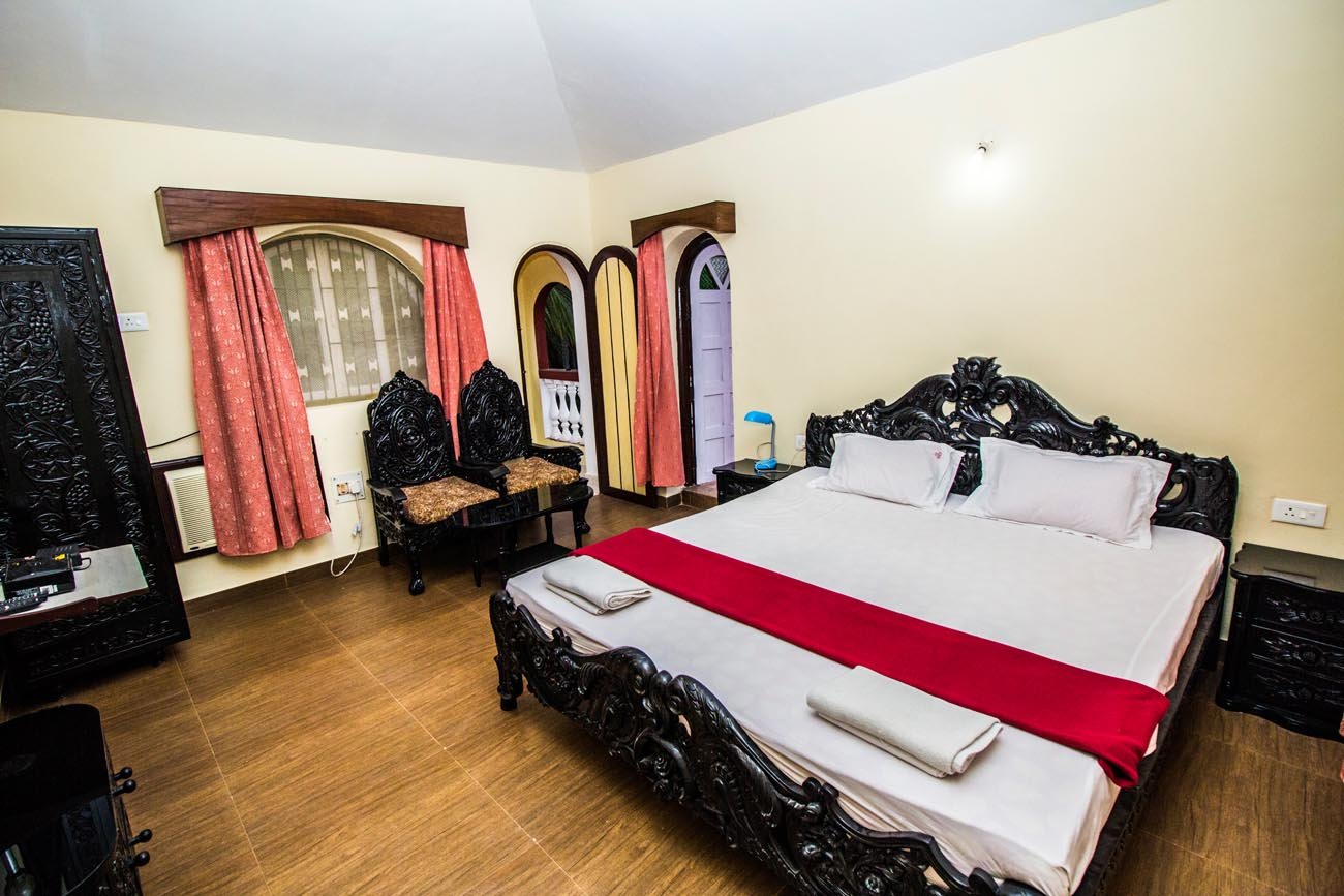 Carved king bed in a resort room
