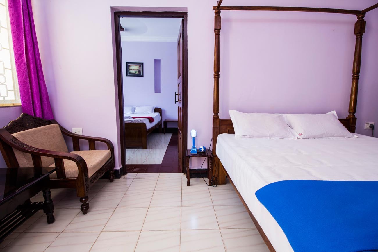 Standard Room with a four-poster bed