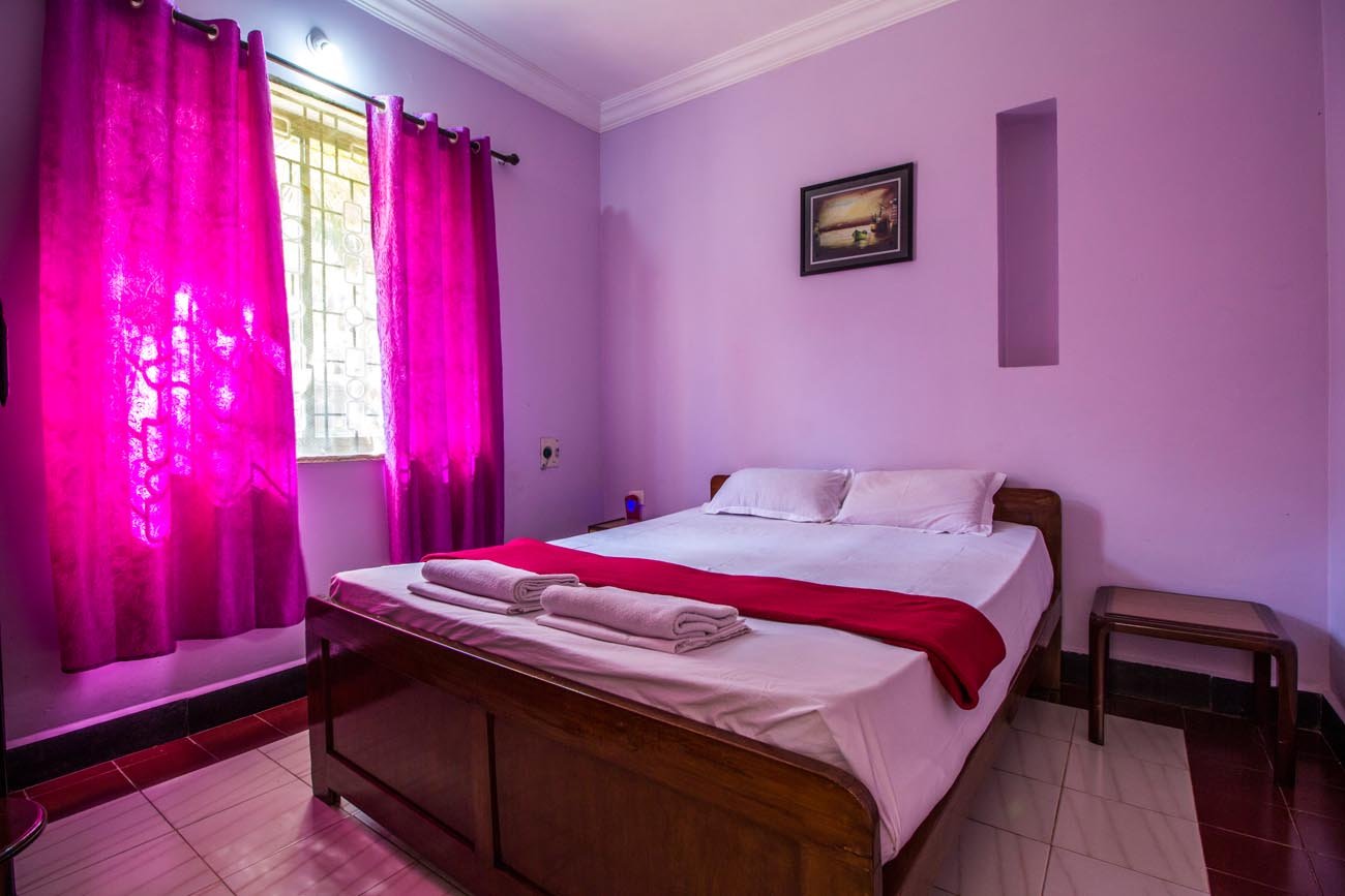 Villa bedroom with pink curtains